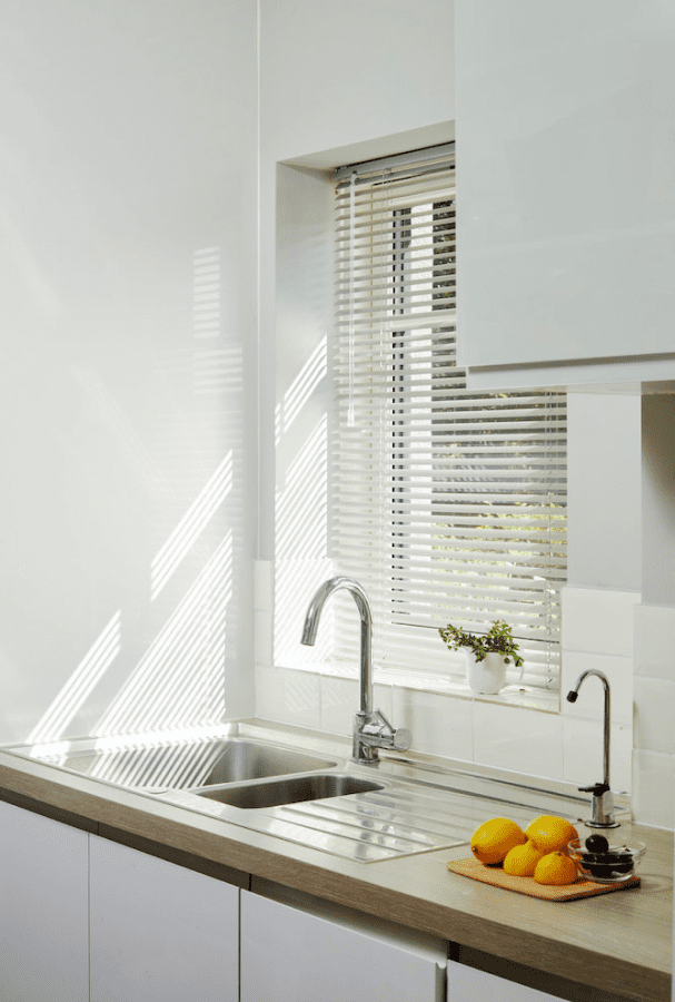 White Venetian Blinds in a Kitchen