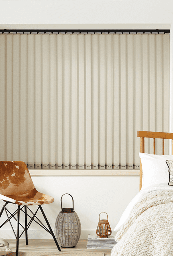 Cream vertical blinds in a bedroom