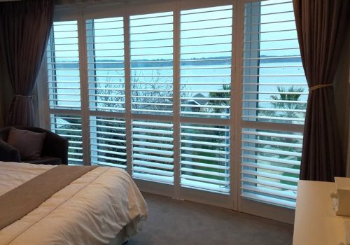 Full Height Shutters in a Bedroom