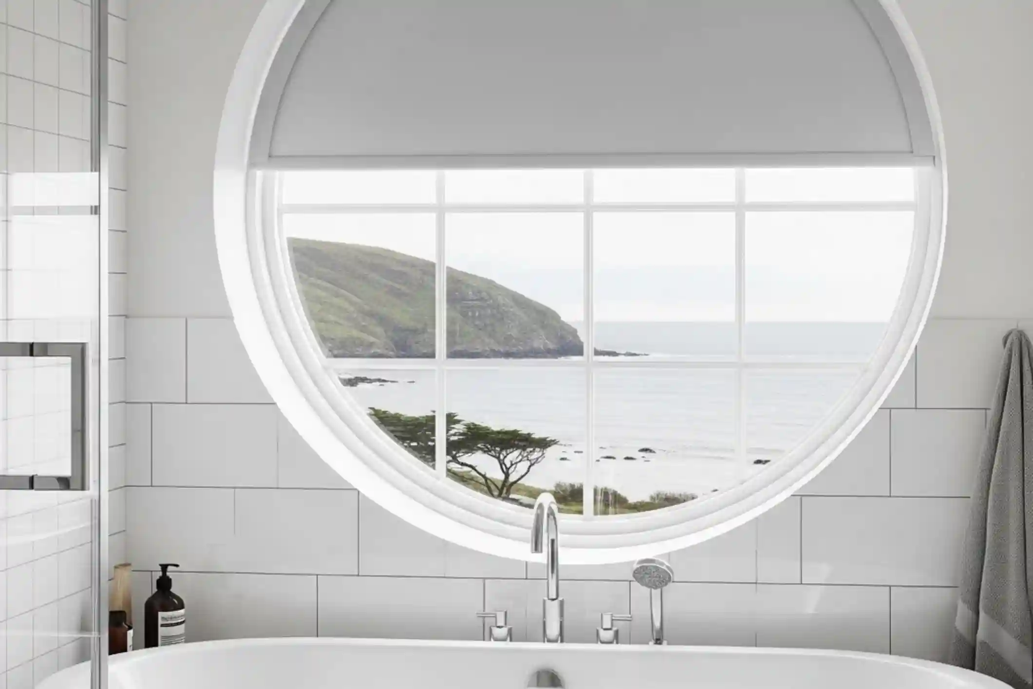 A Bathroom with a circular window, fitted with a custom fit blind