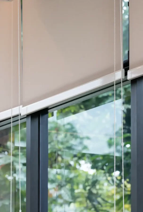 Beige Roller Blinds in a Garden Room