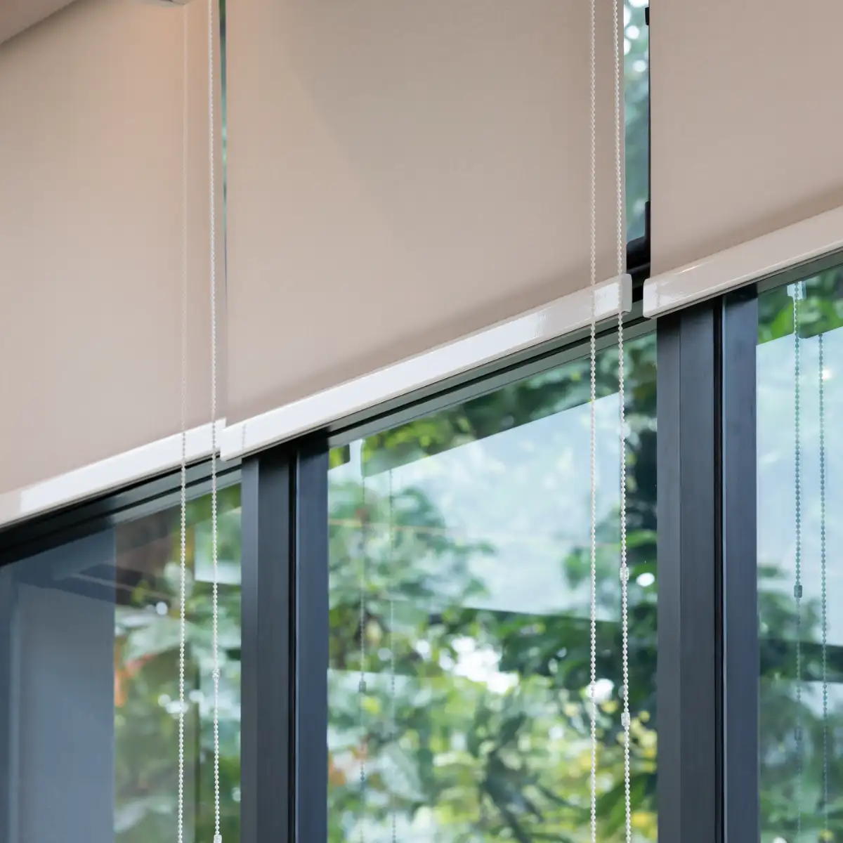 Beige Roller Blinds in a Garden Room
