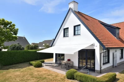 A white B27 awning attached to a house