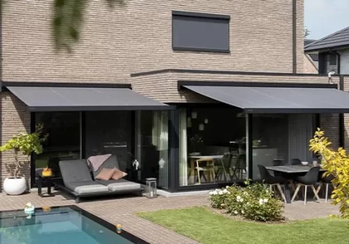2 grey retractable awnings shading seating and dining areas