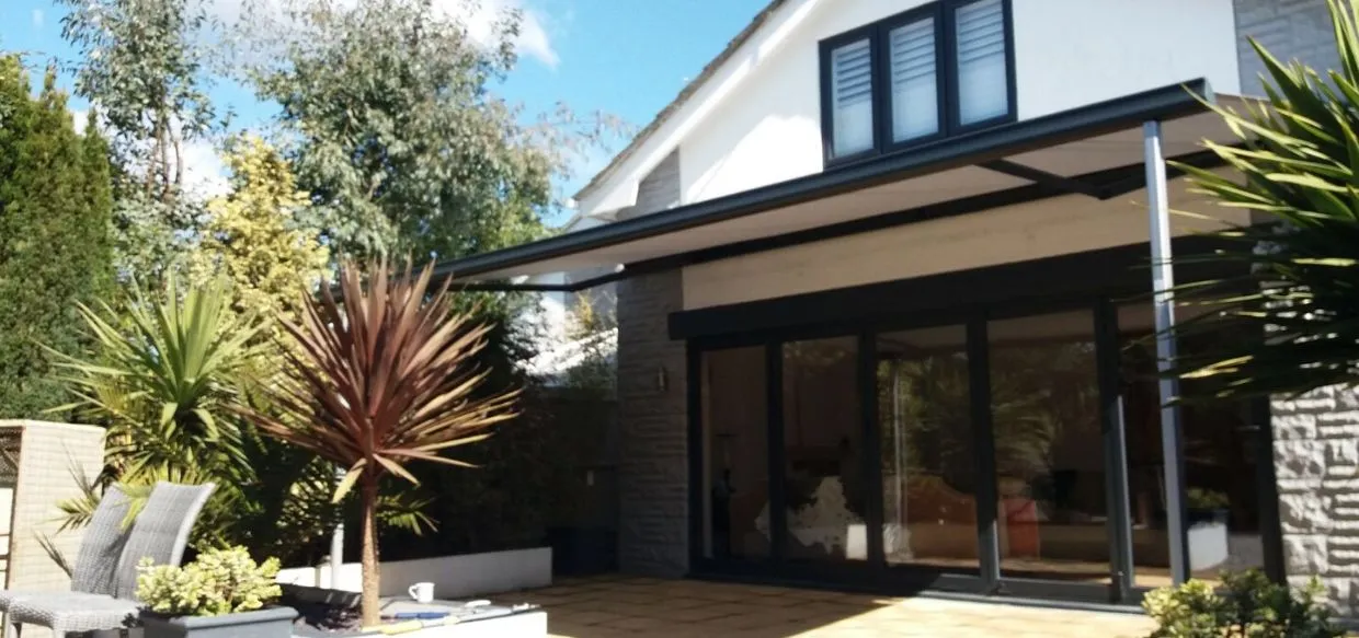 large white awning over a garden patio