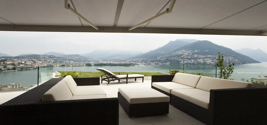 A large patio awning shading garden furniture