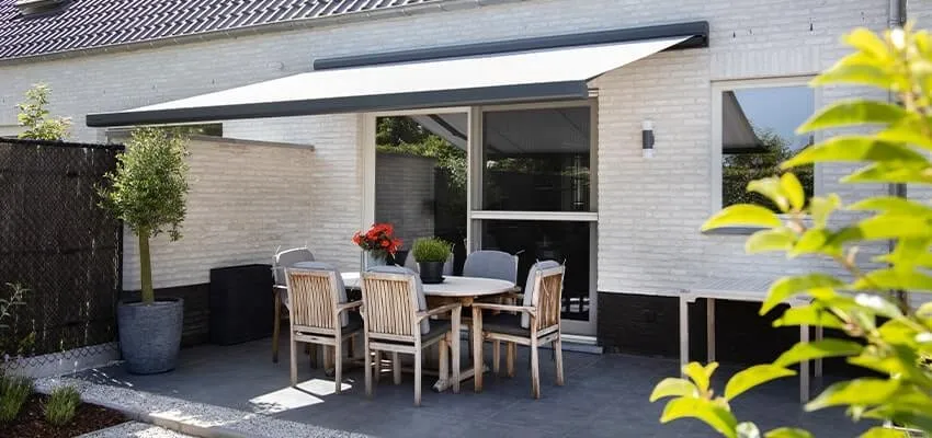 grey awning over a garden patio table